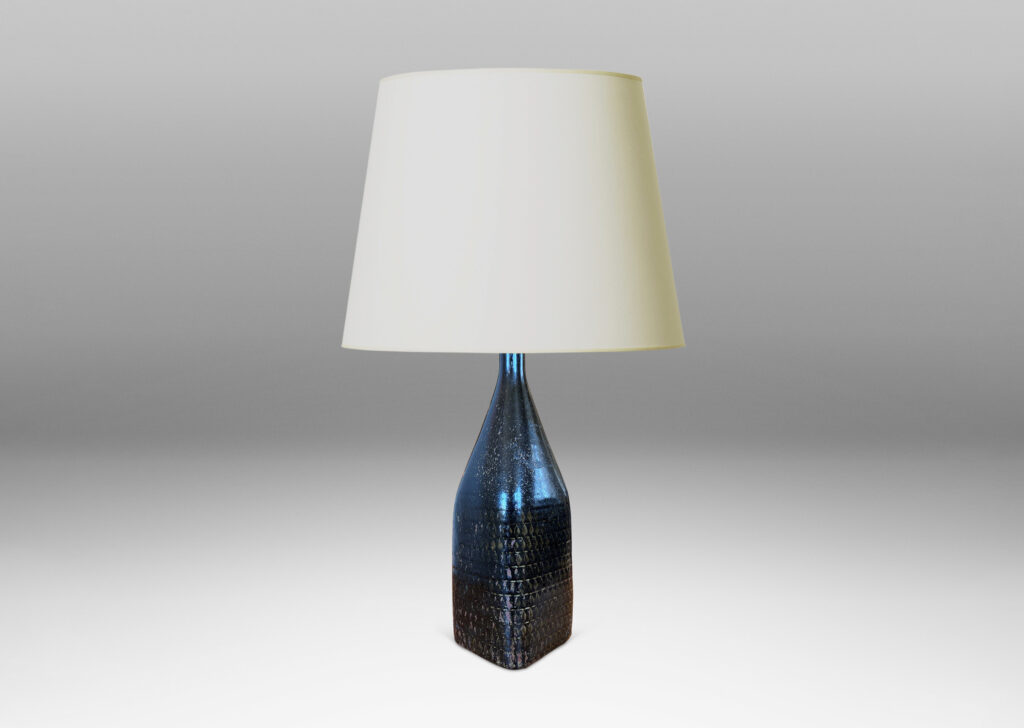 Gallery BAC tall square bottle-like form with rows impressed triangular motifs, glazed in black with hints of red luster