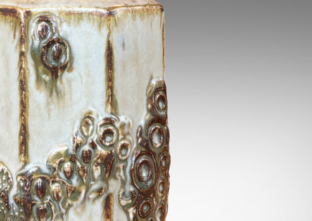 Gallery BAC octagonally faced form with applied abstracted garland reliefs, glazed in pale taupe with brown