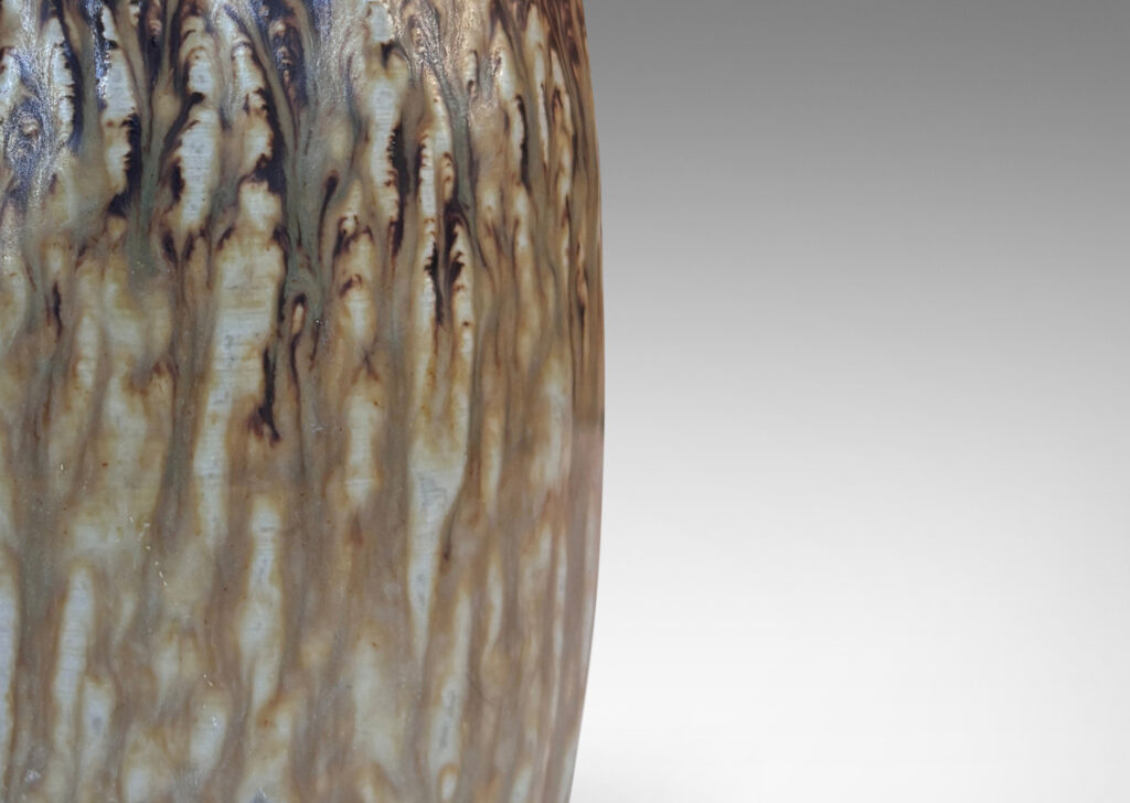 Gallery BAC swelling column forms with rustic texture and flowing brown glaze