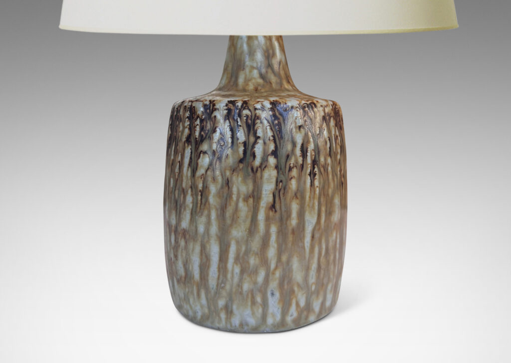 Gallery BAC swelling column forms with rustic texture and flowing brown glaze