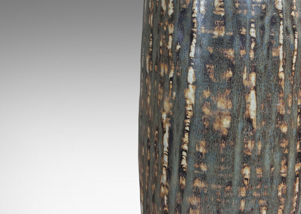 Gallery BAC swelling column forms with rustic texture and flowing brown glaze
