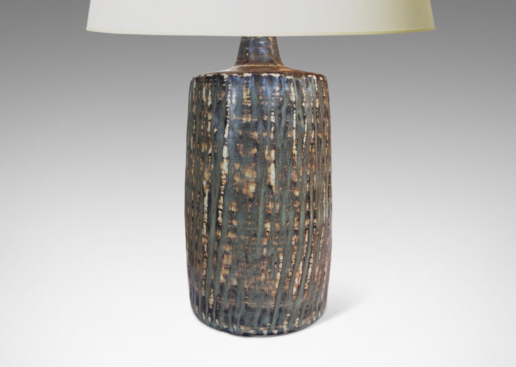 Gallery BAC swelling column forms with rustic texture and flowing brown glaze