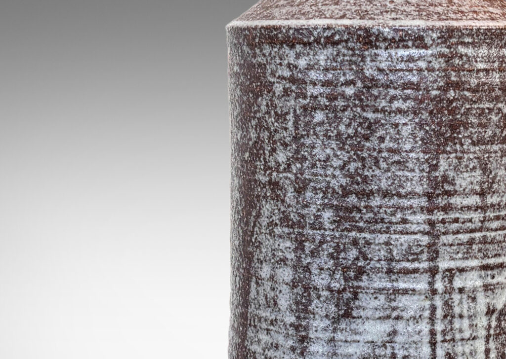 Gallery BAC tall ridged columnar form, glazed in pale gray over brown