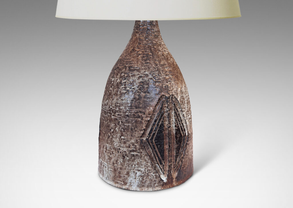 Gallery BAC bell form with carved triangular motifs, glazed in pale gray-tan and brown