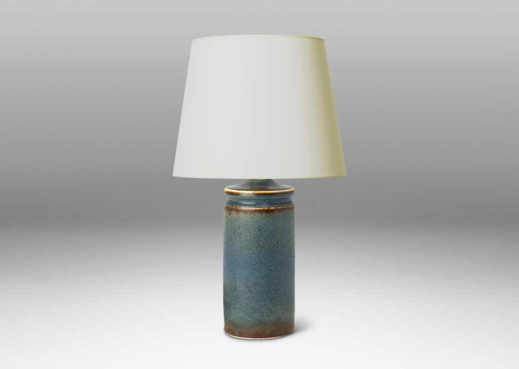Gallery BAC cylindrical forms with exotic capped tops, glazed in a soft blue with brown