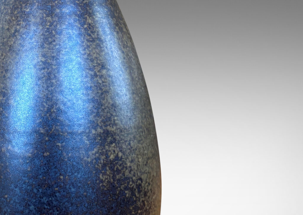 Gallery BAC swelling bulbous form with articulated base, glazed in sponged medium and dark brown