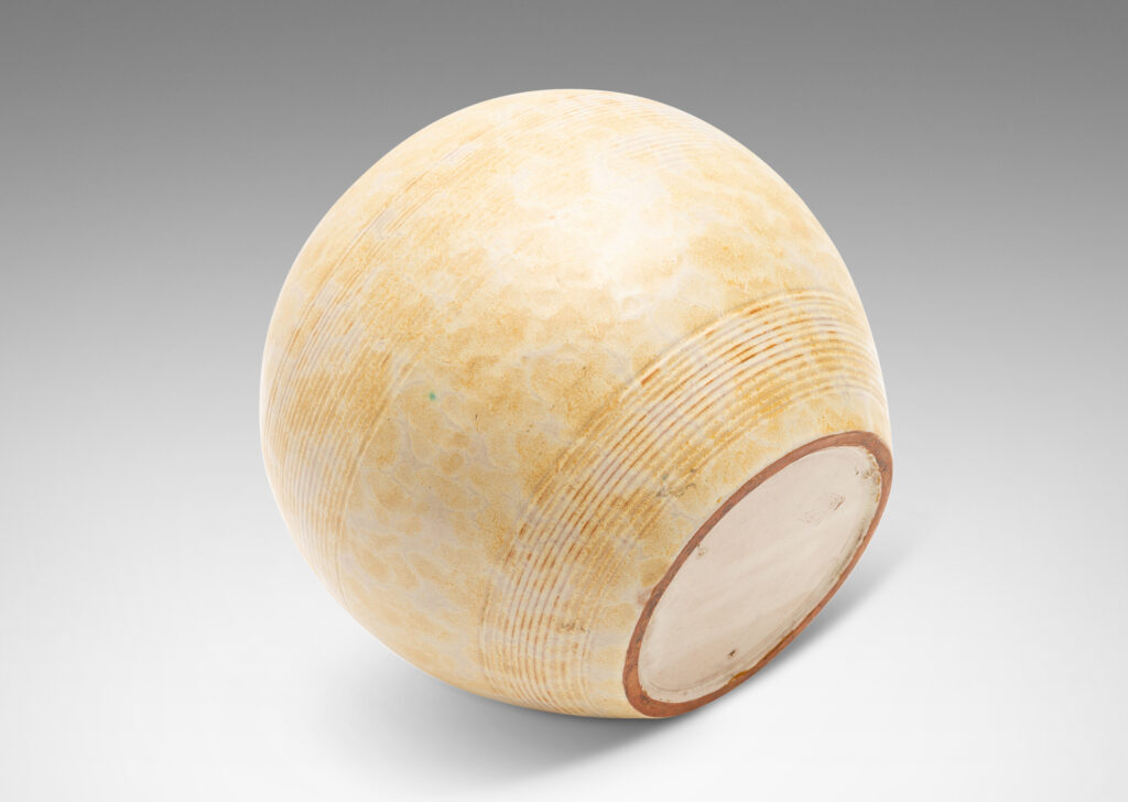 Gallery BAC wide globe form with bands of relief ridges glazed in a pale ochre-buff