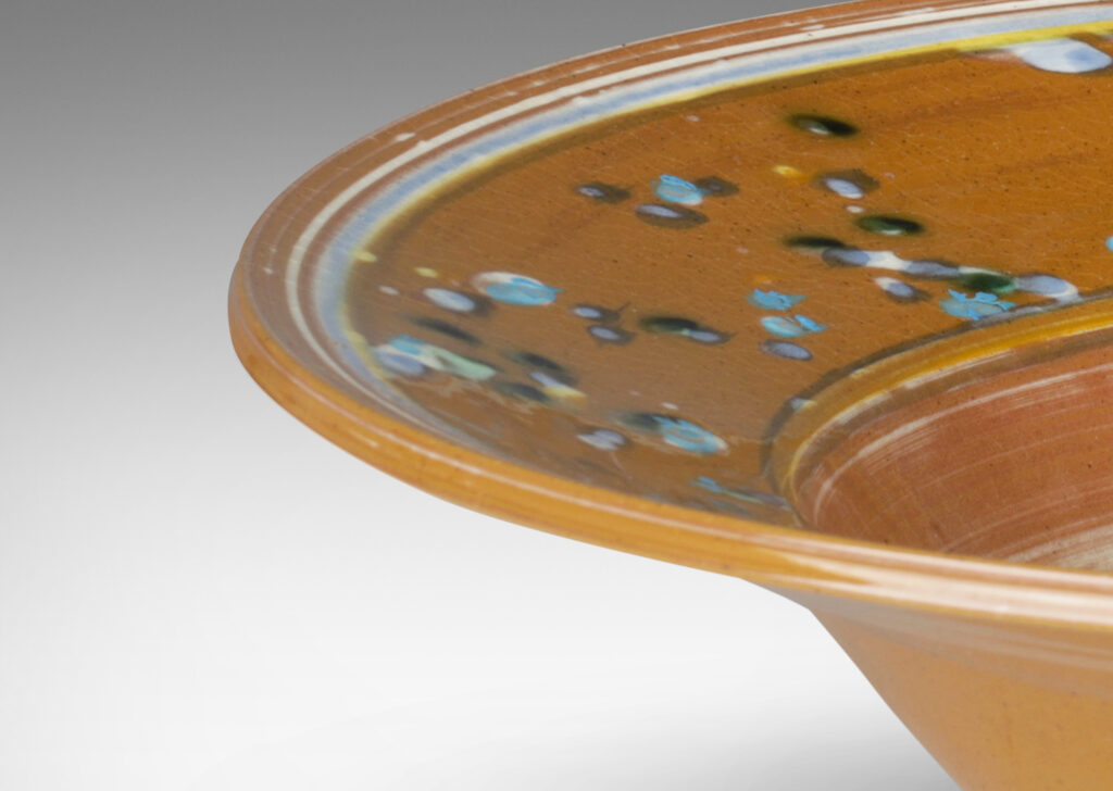 Gallery BAC glazed in caramel brown with stripes, drips and swirl in white, blue and yellow