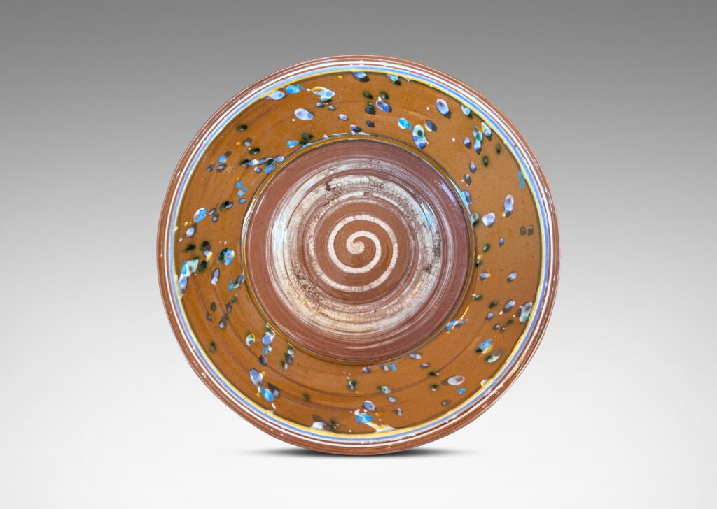 Gallery BAC glazed in caramel brown with stripes, drips and swirl in white, blue and yellow
