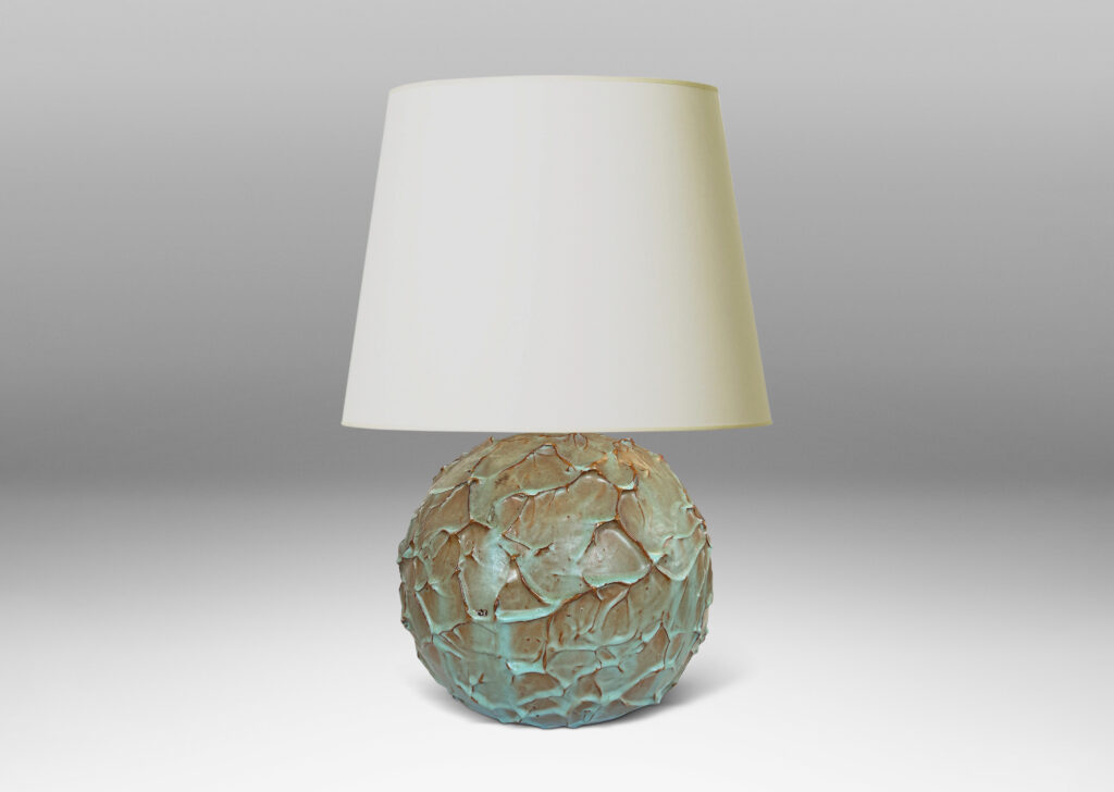 Gallery BAC highly textured globe form in a bright celadon glaze with brown tinted edges from the underlying ceramic
