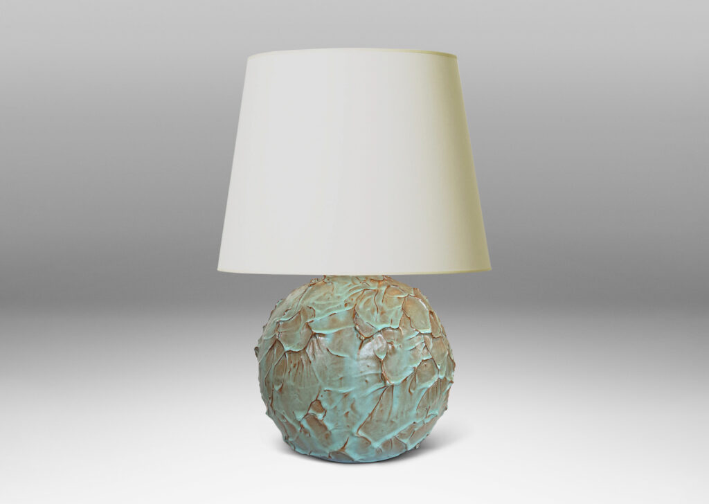 Gallery BAC highly textured globe form in a bright celadon glaze with brown tinted edges from the underlying ceramic