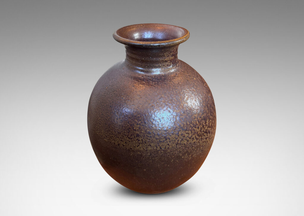 Gallery BAC globe form with wide neck and flared mouth in a dark brown salt glaze