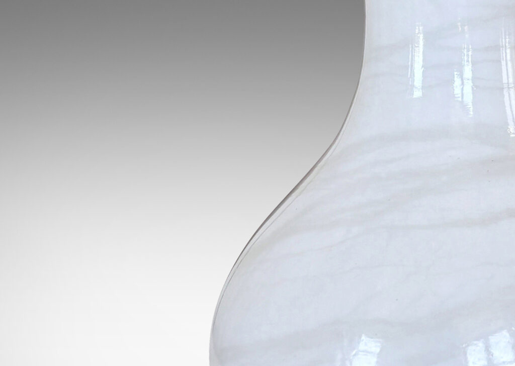 Gallery BAC vase-like forms in solid turned white marble with pale veining
