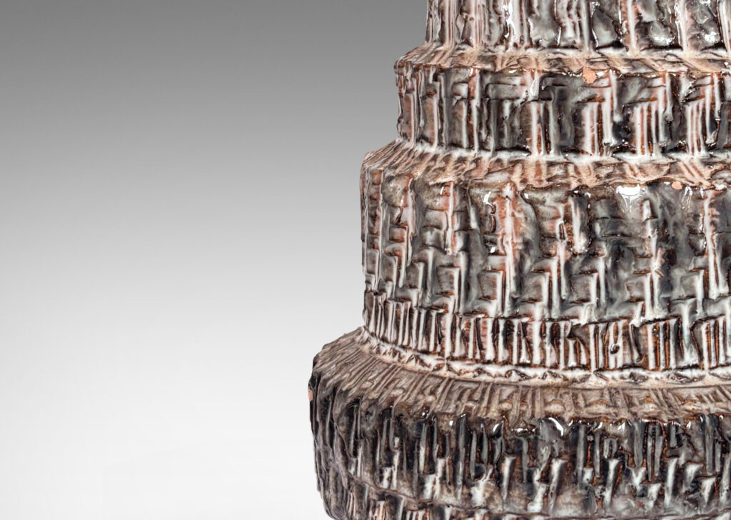 Gallery BAC textured tiered form, glazed in pale warm gray and dark brown