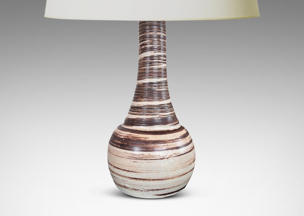 Gallery BAC compressed globe and tall thick neck, with ridged surface, glazed in light gray with brown spiral