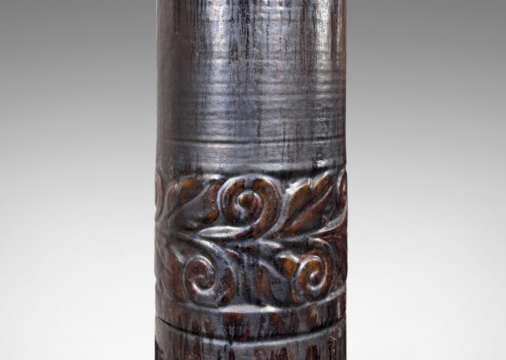 Gallery BAC columnar forms with relief bands of folk foliage, glazed in flowing dark brown