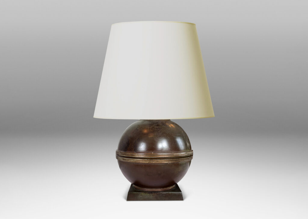 Gallery BAC spherical form with relief engraved equatorial band and a square plinth, with a rich antique patination