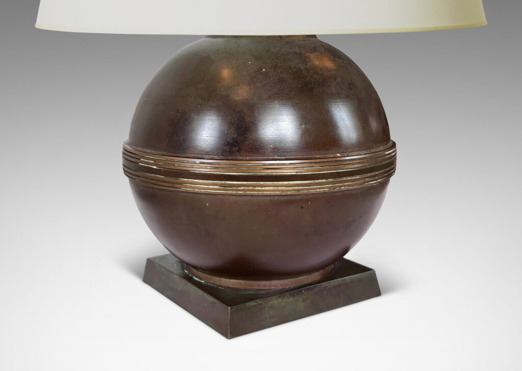 Gallery BAC spherical form with relief engraved equatorial band and a square plinth, with a rich antique patination
