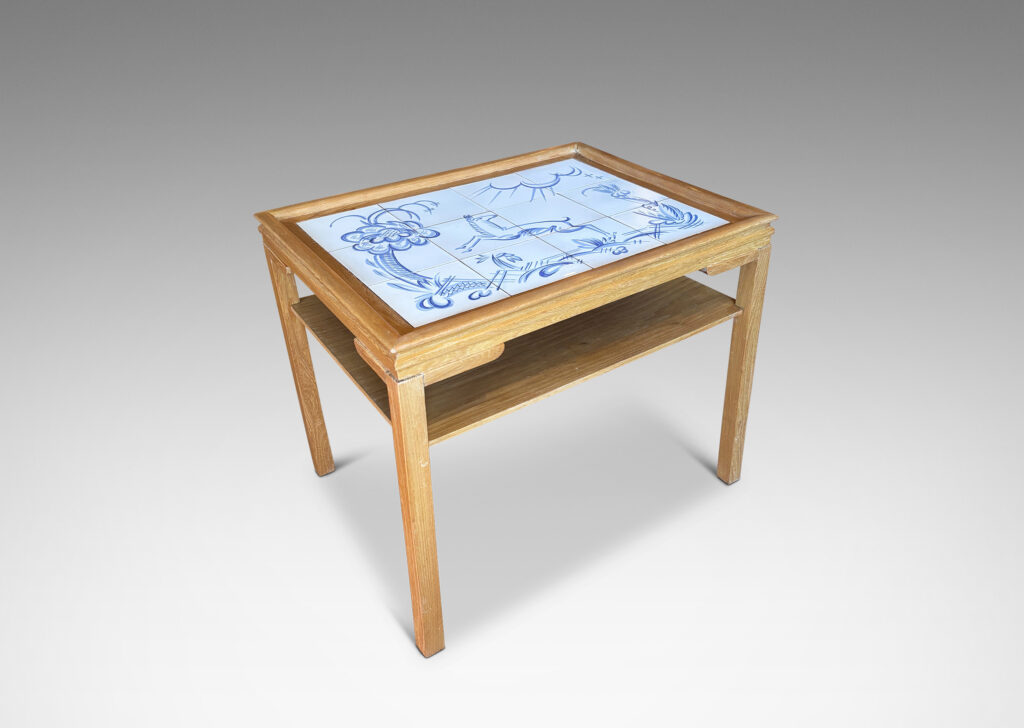 Gallery BAC rectangular top with sculpted lip, tapered legs and shelf, featuring a tile top surface in white glaze with charming hand-painted deer and landscape design in blue