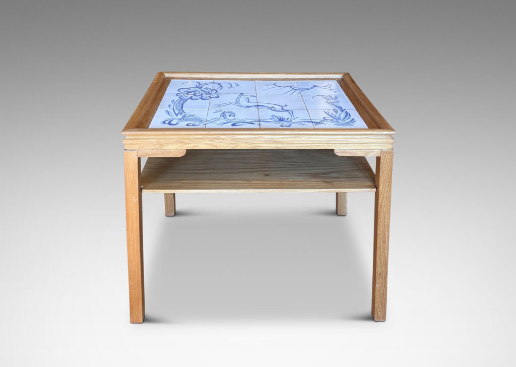 Gallery BAC rectangular top with sculpted lip, tapered legs and shelf, featuring a tile top surface in white glaze with charming hand-painted deer and landscape design in blue