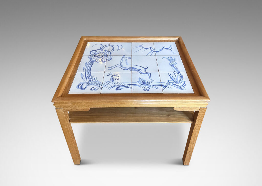 Gallery BAC rectangular top with sculpted lip, tapered legs and shelf, featuring a tile top surface in white glaze with charming hand-painted deer and landscape design in blue