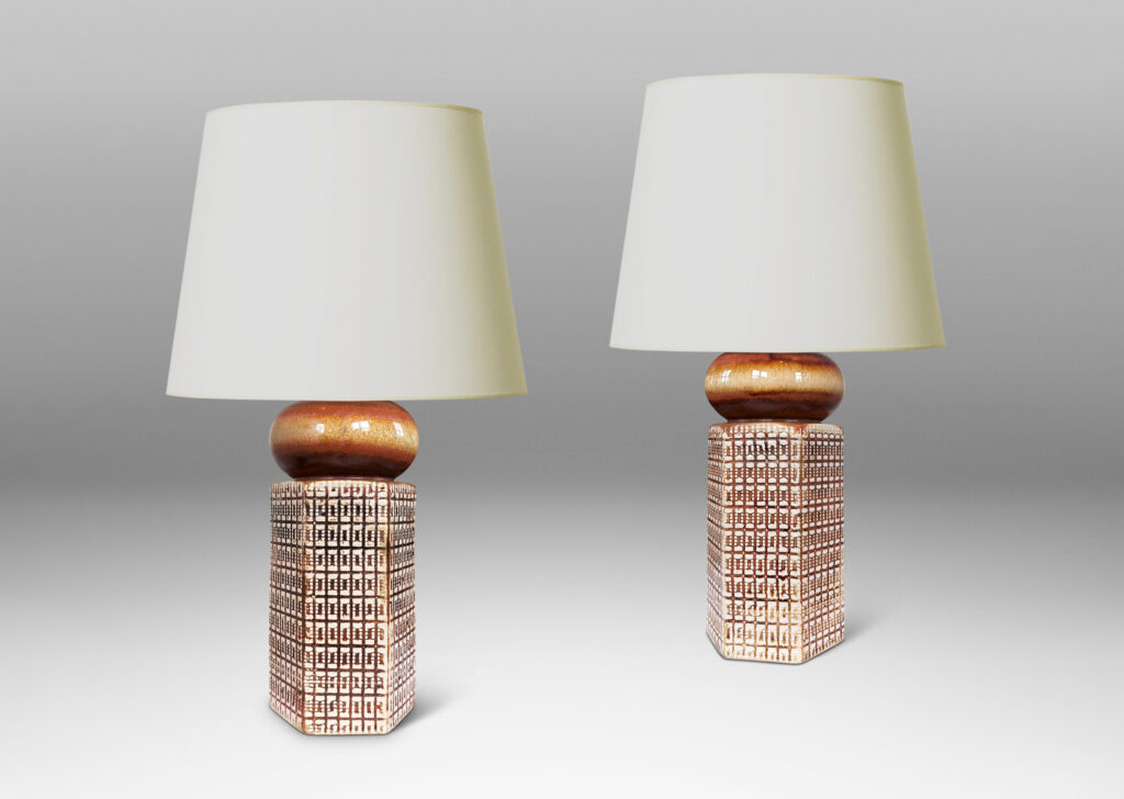Gallery BAC hexagonal forms with gridded textural reliefs and bun-shaped caps, glazed in brown over ivory