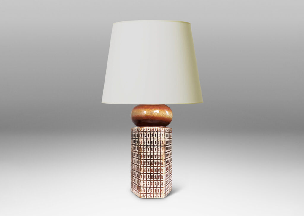 Gallery BAC hexagonal forms with gridded textural reliefs and bun-shaped caps, glazed in brown over ivory