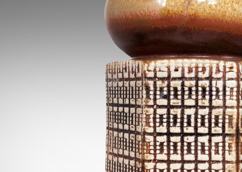 Gallery BAC hexagonal forms with gridded textural reliefs and bun-shaped caps, glazed in brown over ivory