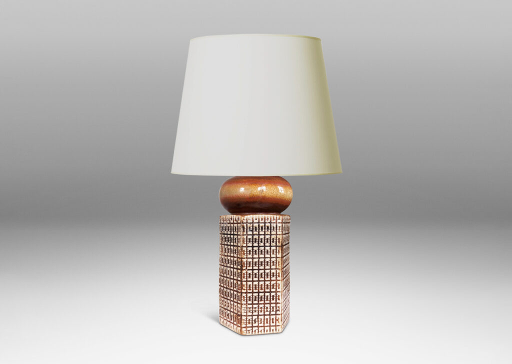 Gallery BAC hexagonal forms with gridded textural reliefs and bun-shaped caps, glazed in brown over ivory