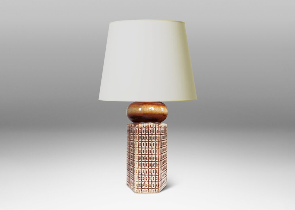 Gallery BAC hexagonal forms with gridded textural reliefs and bun-shaped caps, glazed in brown over ivory