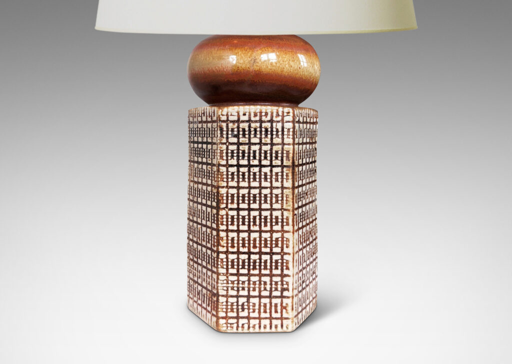 Gallery BAC hexagonal forms with gridded textural reliefs and bun-shaped caps, glazed in brown over ivory