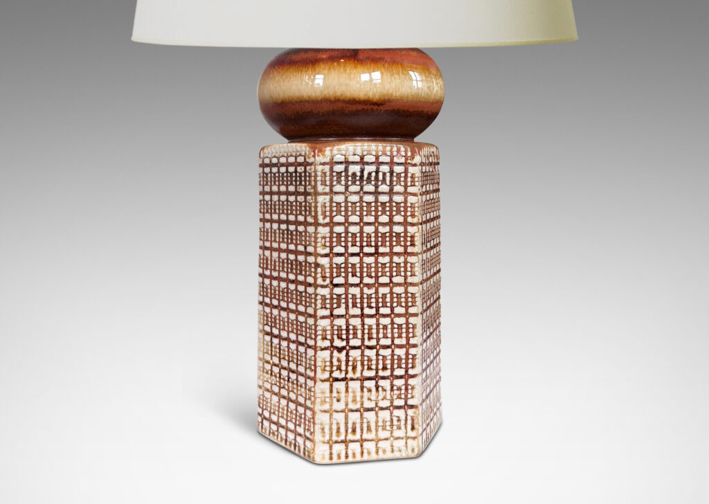 Gallery BAC hexagonal forms with gridded textural reliefs and bun-shaped caps, glazed in brown over ivory
