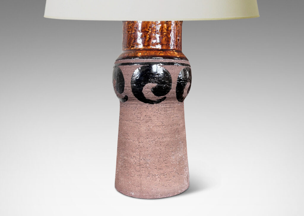 Gallery BAC subtly raked columnar form with engaged knob, glazed with swirl motifs in matte and shiny brown