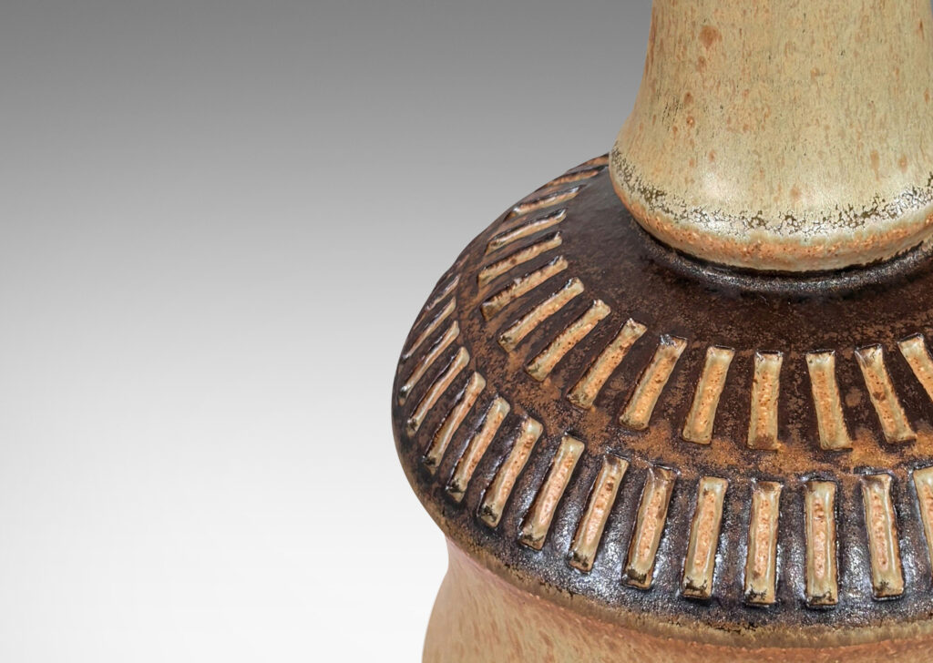 Gallery BAC drum forms with tall necks and intaglio reeded ring around shoulders, glazed in tan and brown