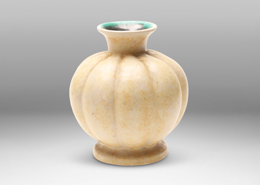 Gallery BAC lobed form with spouting mouth and disk plinth, glazed in sponged butter yellow outside and turquoise inside