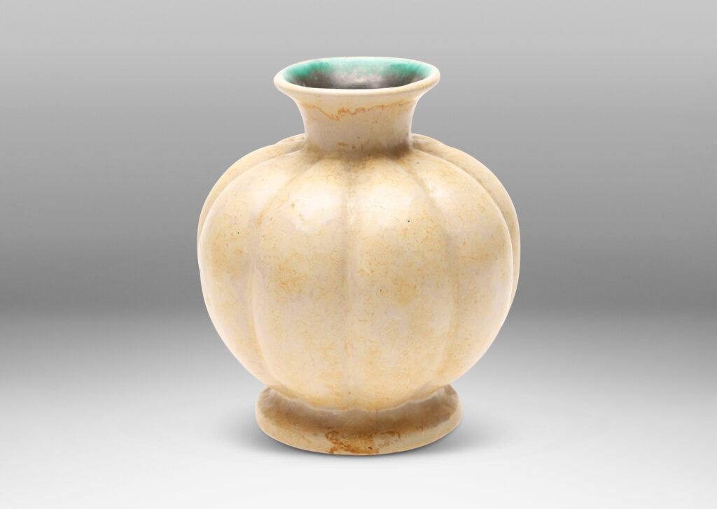 Gallery BAC lobed form with spouting mouth and disk plinth, glazed in sponged butter yellow outside and turquoise inside