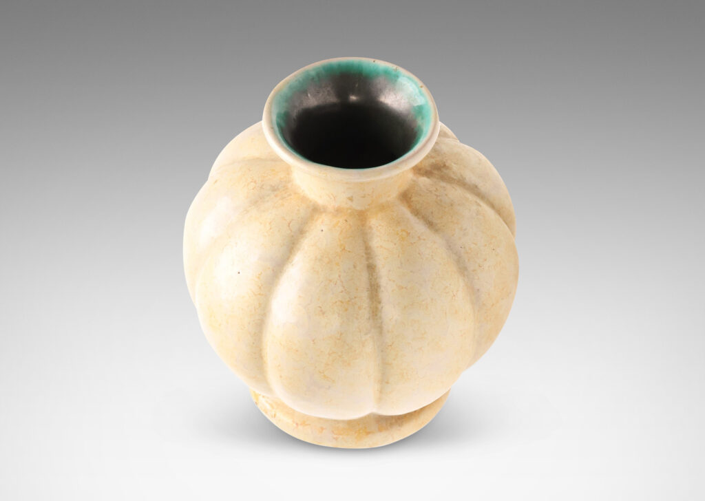 Gallery BAC lobed form with spouting mouth and disk plinth, glazed in sponged butter yellow outside and turquoise inside