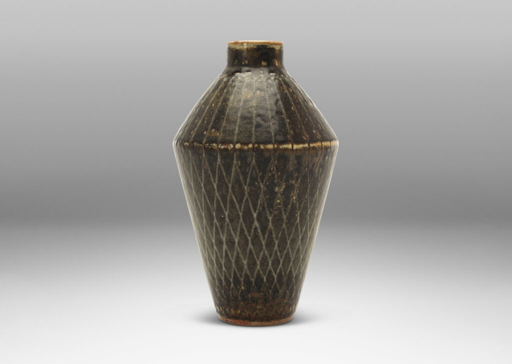 Gallery BAC angled tapered vase with carved radial lines and diamond pattern, glazed in gray-black