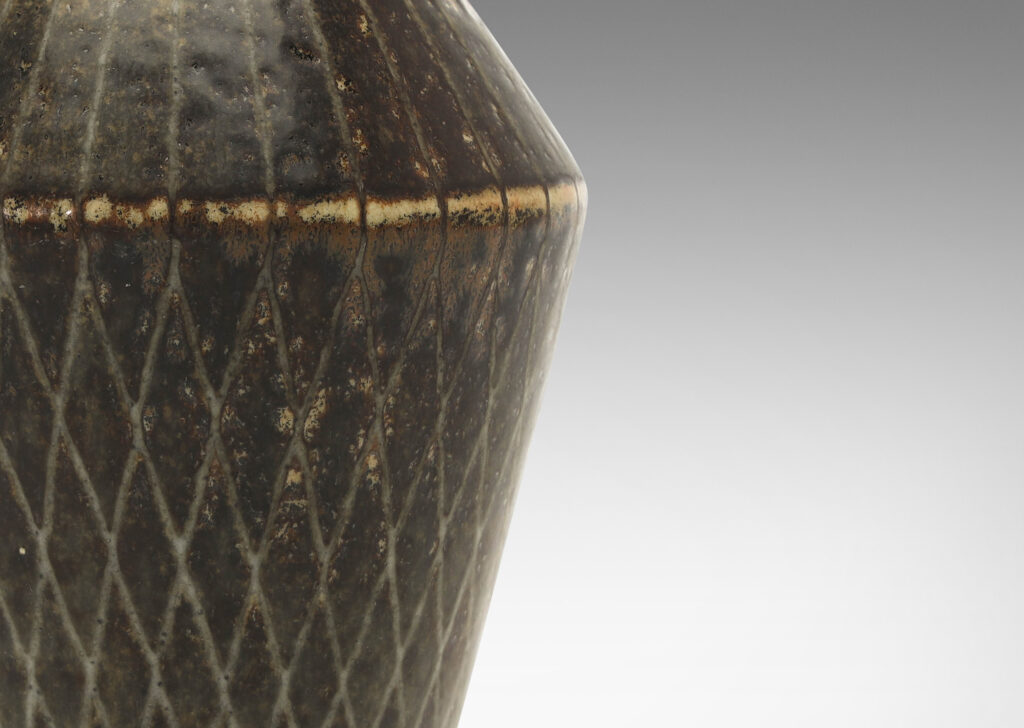 Gallery BAC angled tapered vase with carved radial lines and diamond pattern, glazed in gray-black