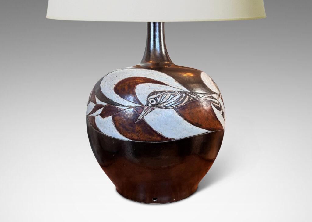Gallery BAC arge apple-like form with carved free-form band of birds and shapes, glazed in a dark brown luster