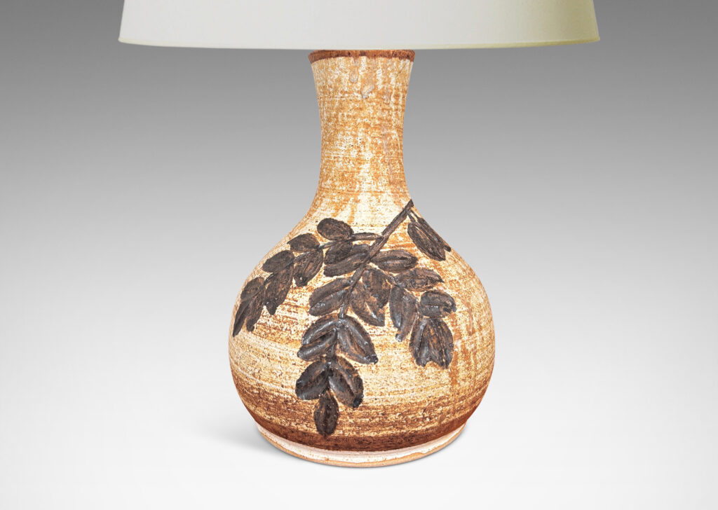 Gallery BAC swelling form with flared neck, with grog texture and carved foliate design, glazed in a pale golden beige with medium brown dry brush striae texture and dark brown decoration