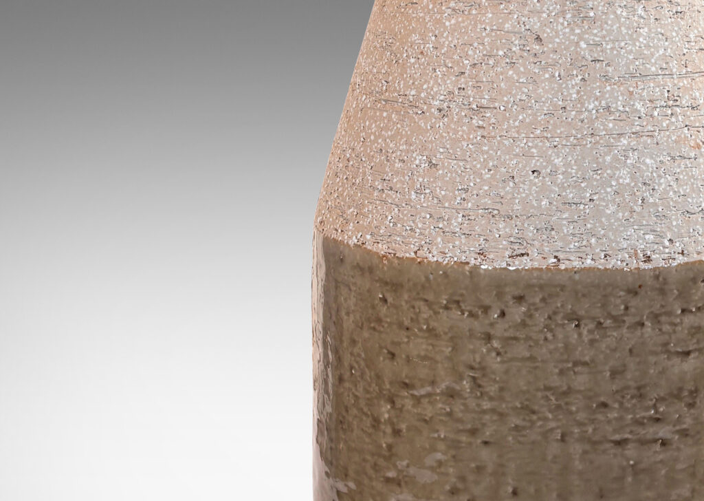 Gallery BAC drum form with angled neck, in grog ceramic with partial gloss greenish gray gloss