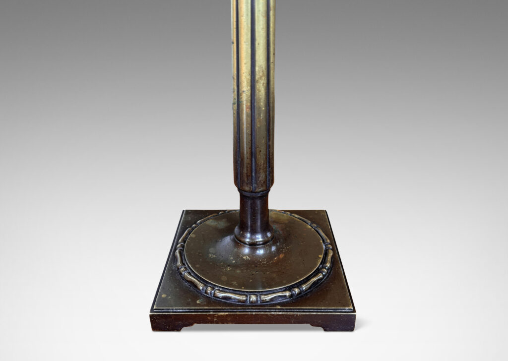 Gallery BAC reeded stand, with block cap, sprouting from a beaded disk on a square plinth