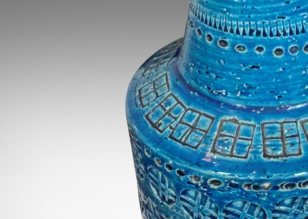 Gallery BAC floating drum form with conical neck, ornamented with impressed geometric motifs, glazed in a saturated cerulean blue