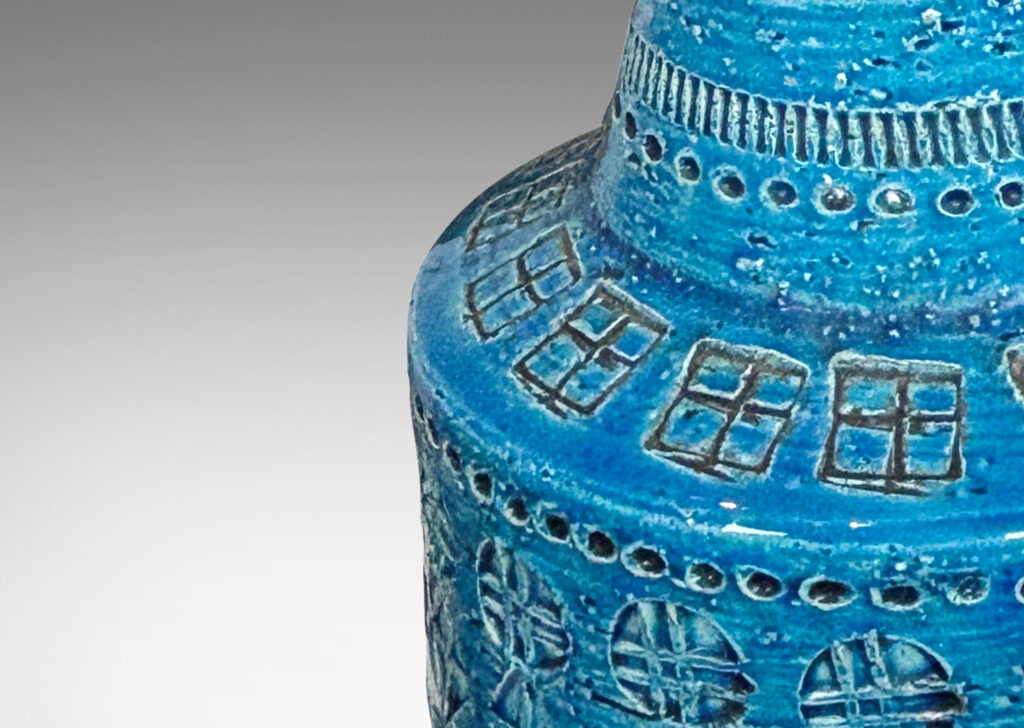 Gallery BAC floating drum form with conical neck, ornamented with impressed geometric motifs, glazed in a saturated cerulean blue