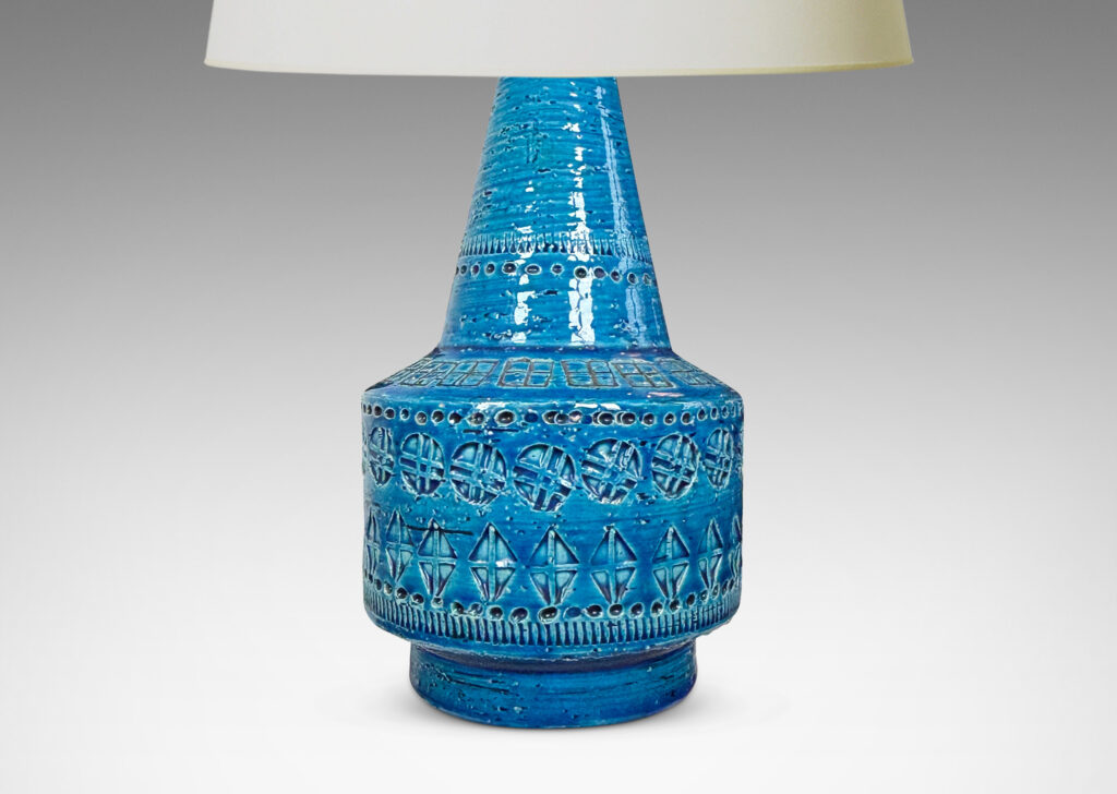 Gallery BAC floating drum form with conical neck, ornamented with impressed geometric motifs, glazed in a saturated cerulean blue