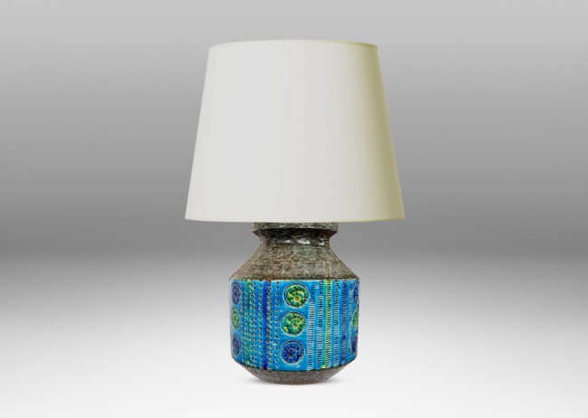 Gallery BAC floating drum form with chamfered edges and carved rosette, strikes and dots, glazed in azure, blue, green and dark gray