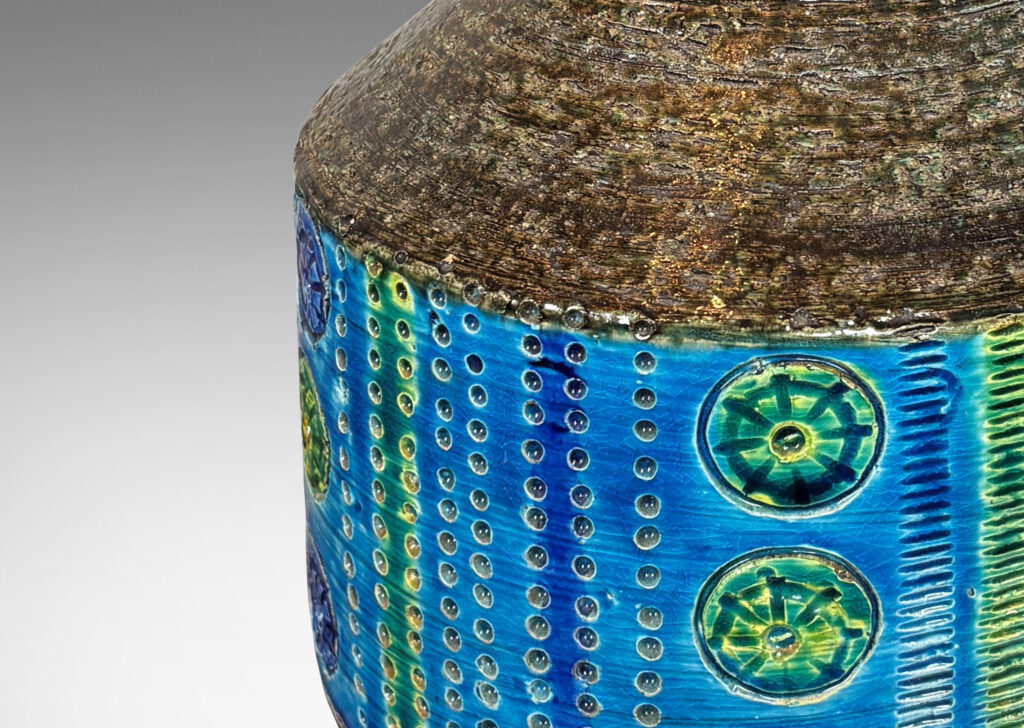 Gallery BAC floating drum form with chamfered edges and carved rosette, strikes and dots, glazed in azure, blue, green and dark gray