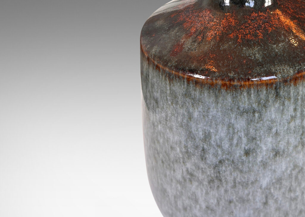 Gallery BAC cylindrical form with rounded edges, glazed in a dappled bluish gray on sides and black-red luster top