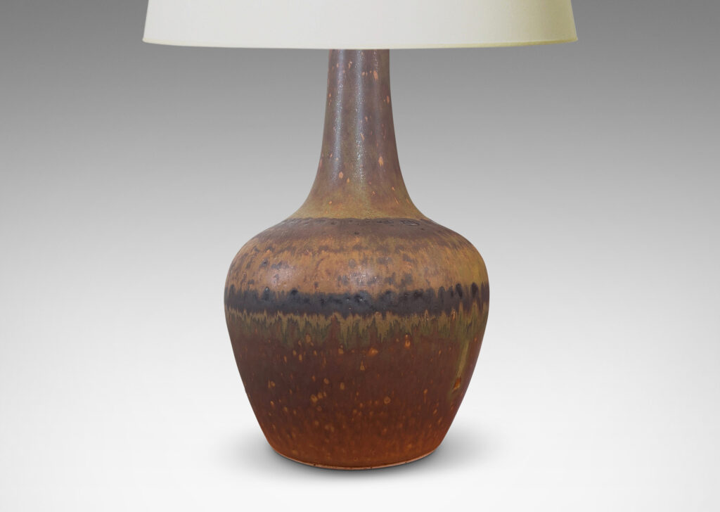 Gallery BAC bulbous form and tall sprouting neck, glazed in a medium brown with green undertones and watery dark brown stripes